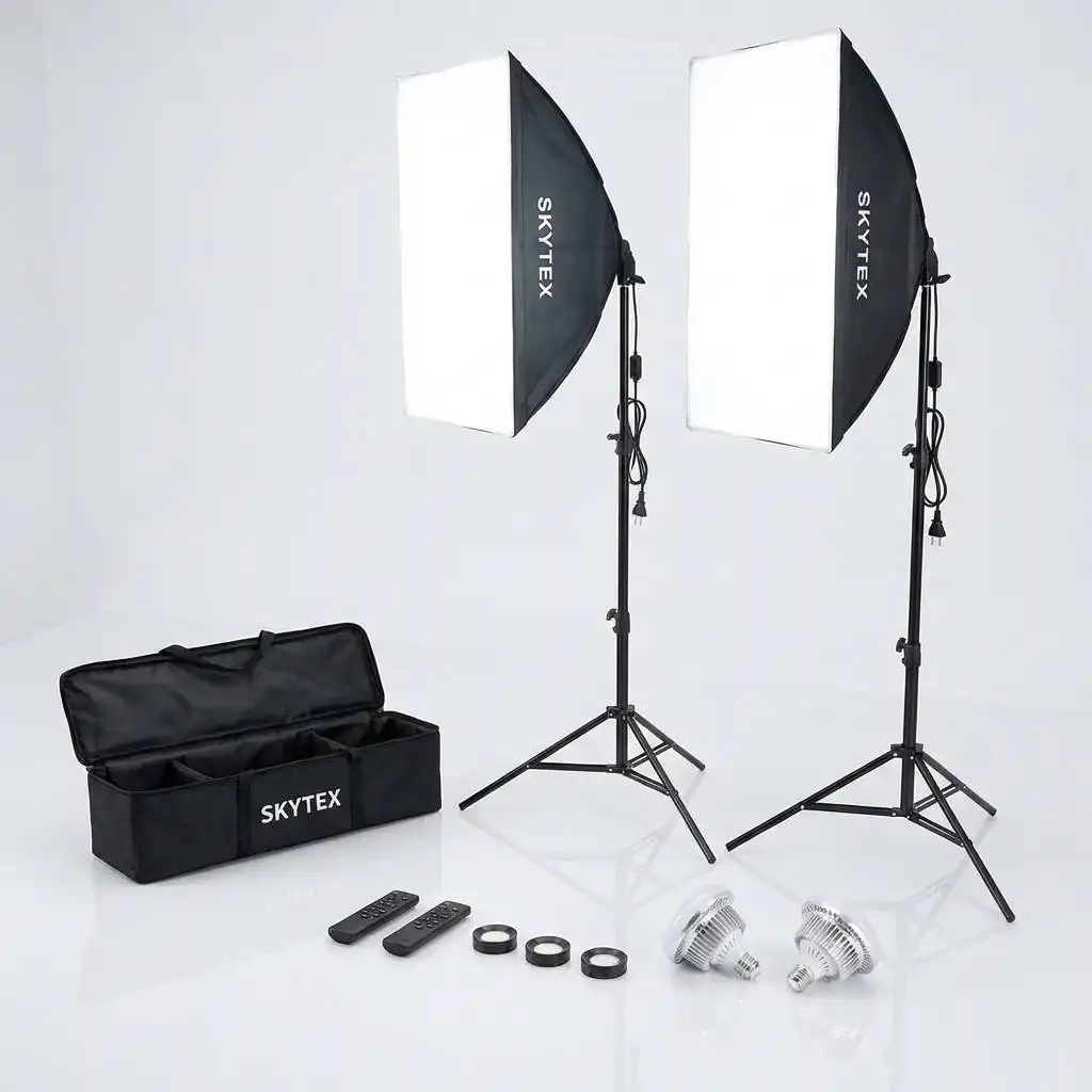 Organized light kit with shiny bulbs displayed next to an open box on a pristine, minimalist studio floor. Organized light kit with shiny bulbs displayed next to an open box on a pristine, minimalist studio floor.