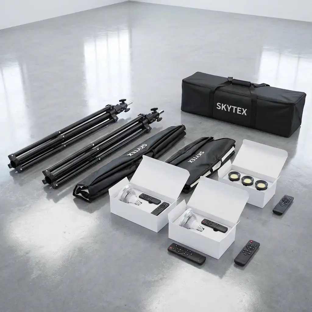 Unpacked professional studio lighting kit with folded stands and boxed bulbs on a polished, spotlessly clean studio floor. Unpacked professional studio lighting kit with folded stands and boxed bulbs on a polished, spotlessly clean studio floor.